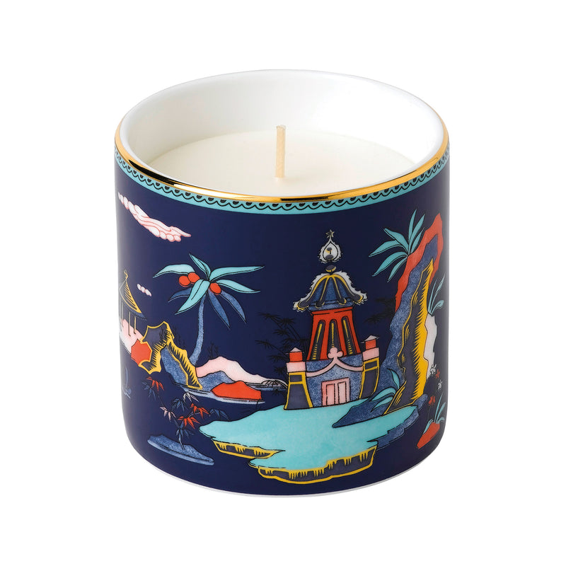 Wedgwood Wonderlust Blue Pagoda candle: dark blue jar with pagoda illustration, lit wick