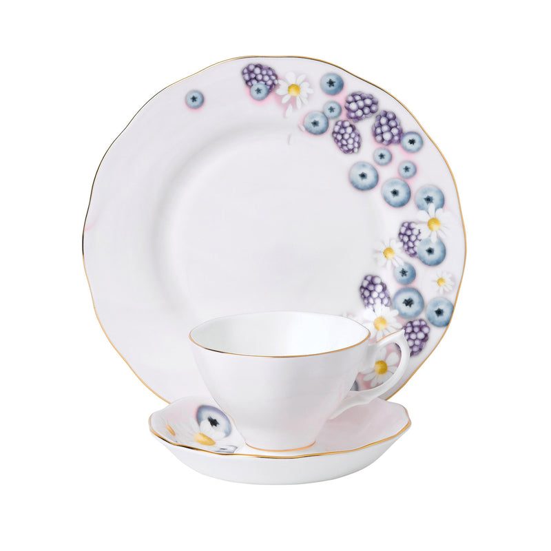 Pink 3-piece tea set with blueberry and daisy motif: cup, saucer, and side plate