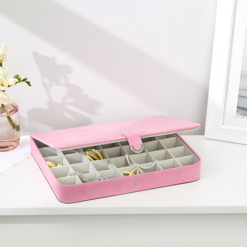 Pink jewelry case open on display with compartment organizer for earrings and bracelets