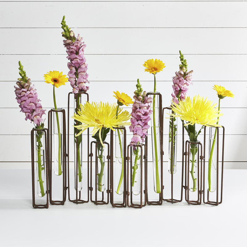 Set of ten hinged flower vases with antiqued rust metal frame and clear glass tubes