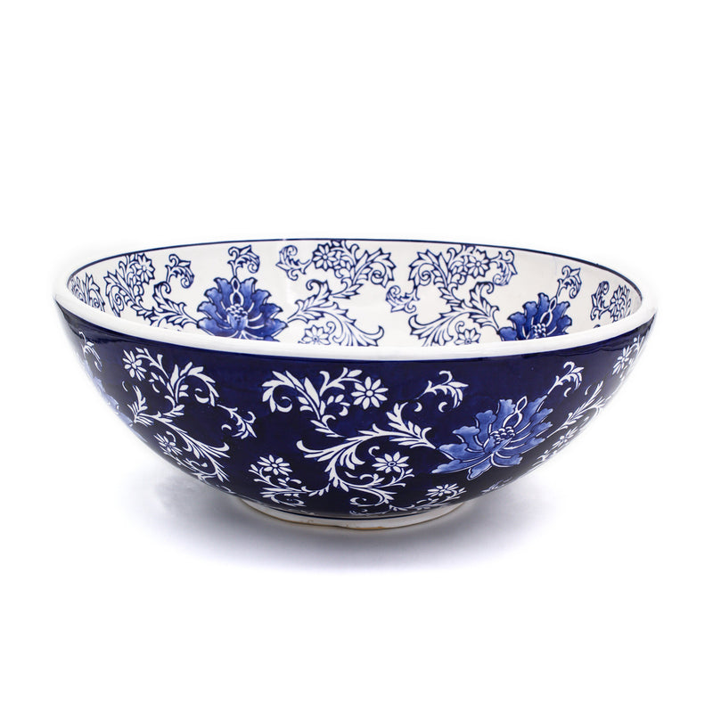 Porcelain fruit bowl with blue handpainted floral scroll pattern, wide rim.
