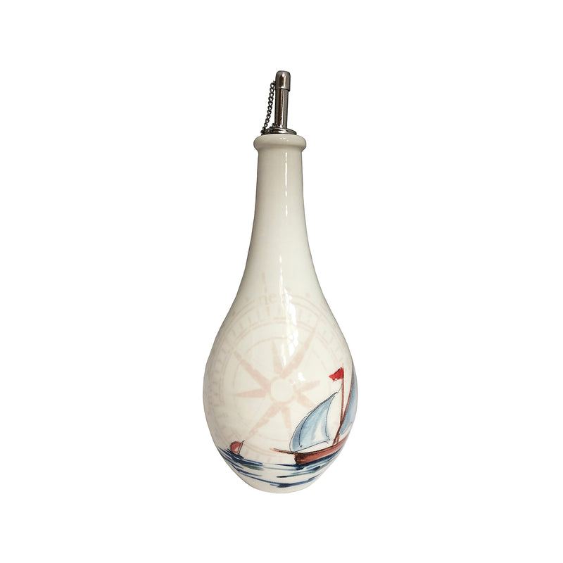White ceramic oil cruet bottle with sailboat illustration and metal pour spout