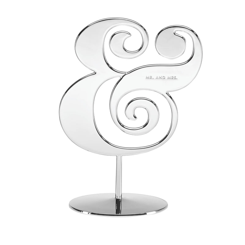 Silverplate cake topper with curled ampersand design on round base