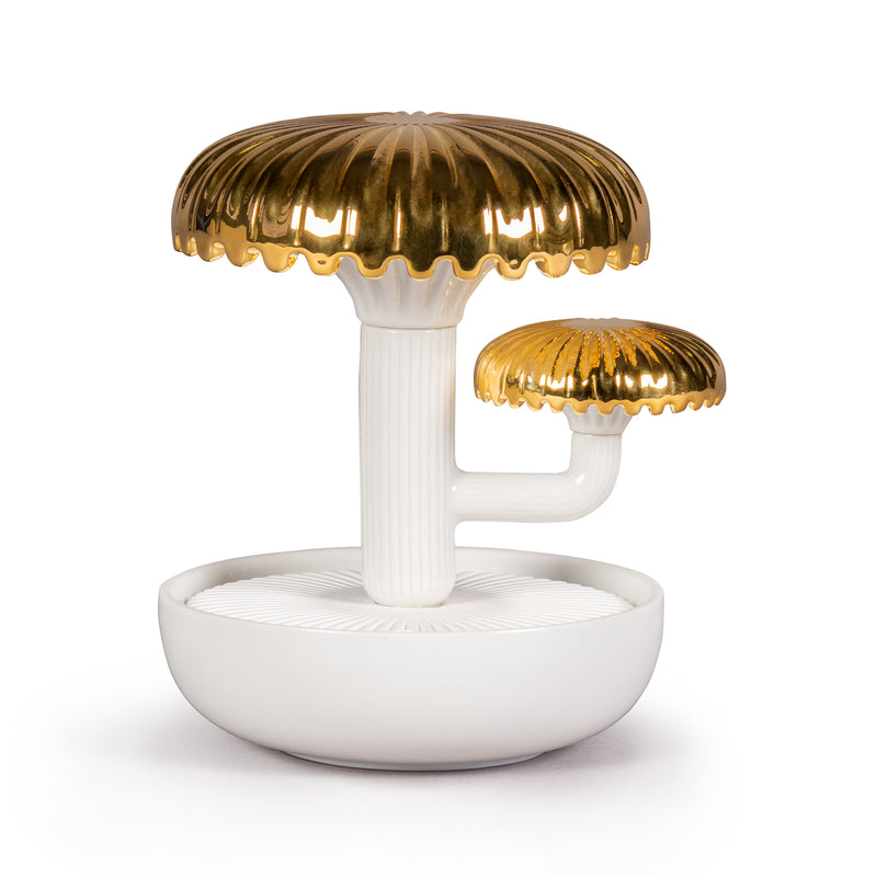 Porcelain air diffuser with white base and gold mushroom-shaped top