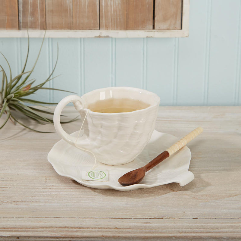 Porcelain shell teacup and plate set, white with scalloped edges and small green stamp