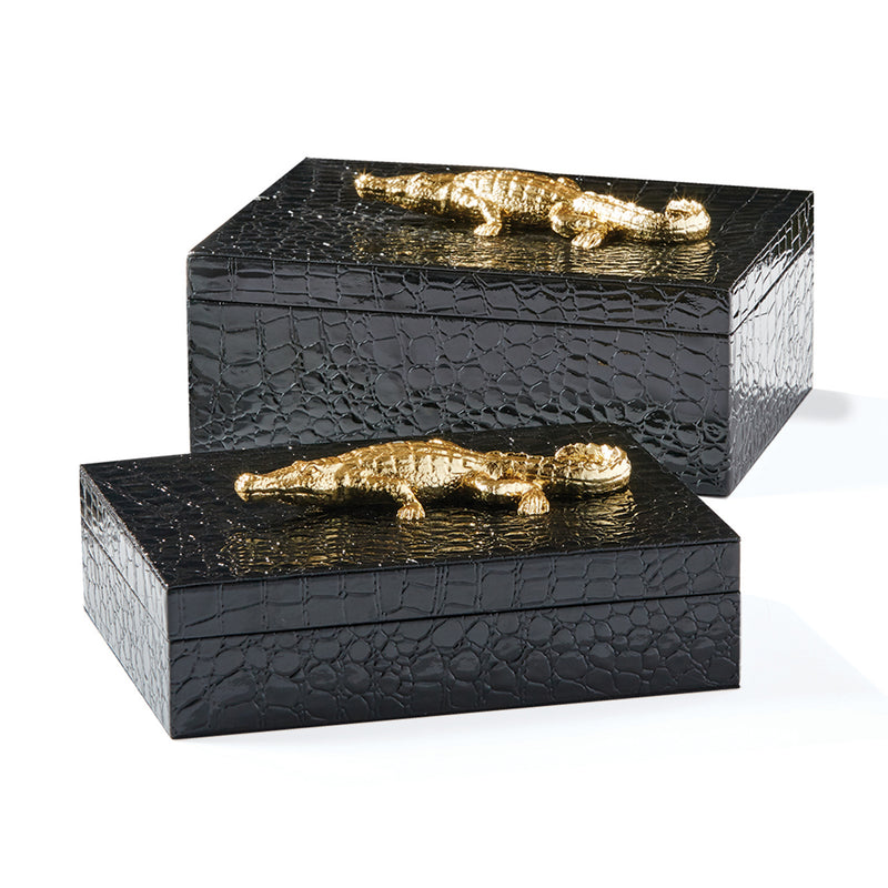 Set of 2 black rectangular covered boxes with embossed texture and gold-tone handles