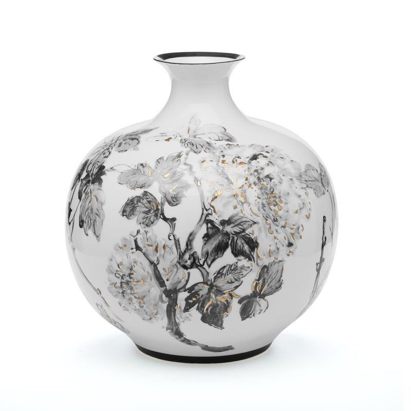 Large porcelain jar, white with black hand-painted floral and gold speckles.