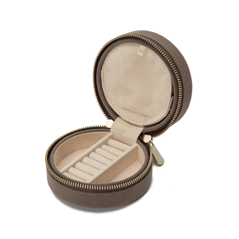 Round velvet jewelry travel case with zipper, hinged tray, and beige ring slots