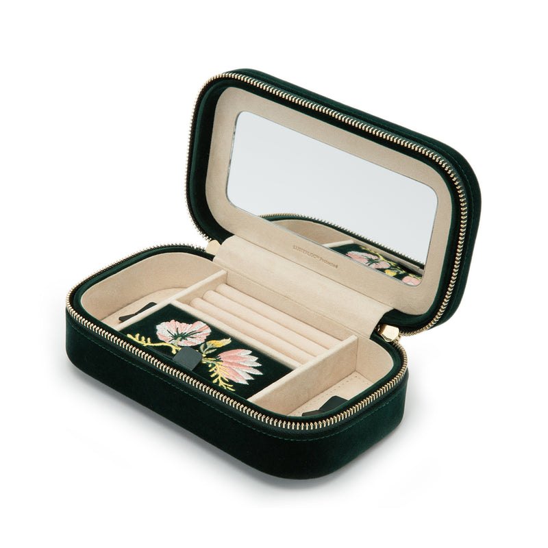 Forest green velvet jewelry travel case with floral interior, zip, and built-in mirror