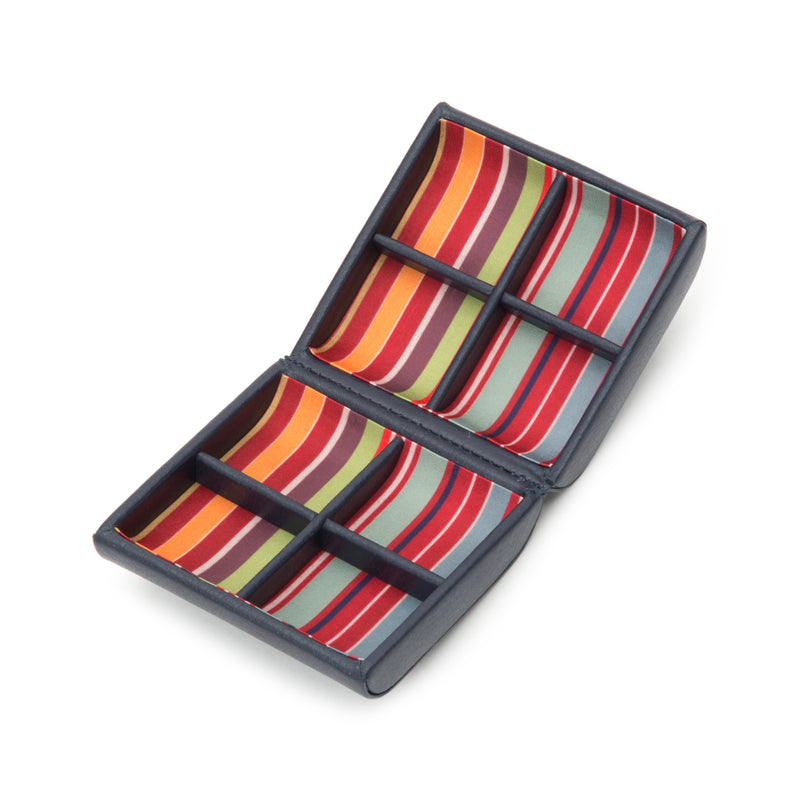 Navy leather cuff link storage box with four striped fabric inserts