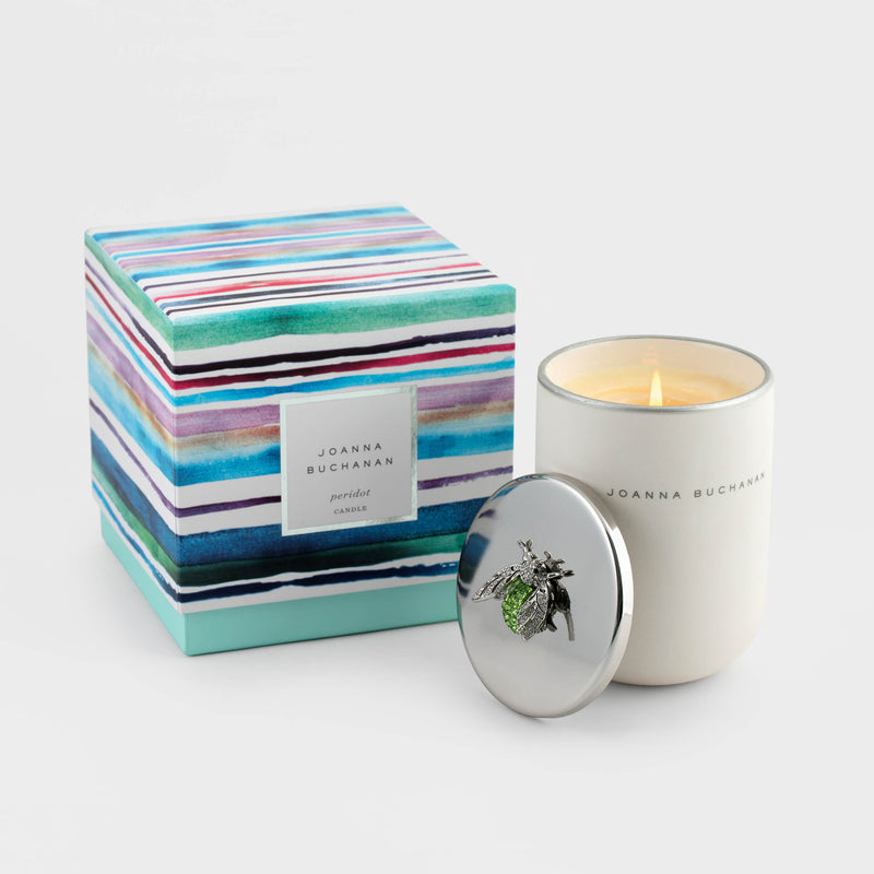 Joanna Buchanan Peridot candle in white jar with silver lid and decorative topper