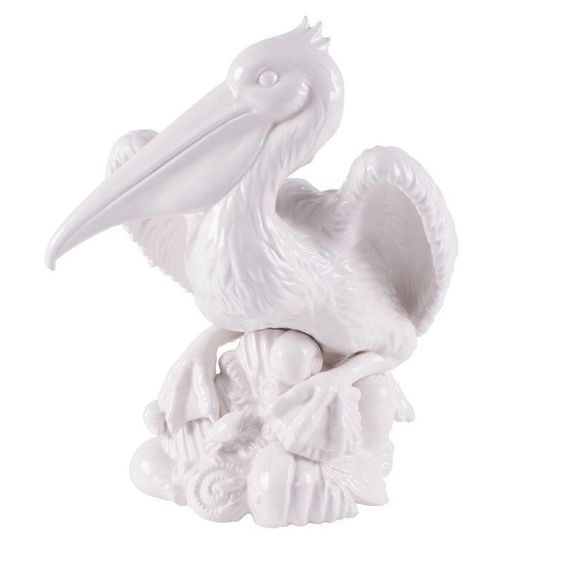 White pelican figurine with fish in beak, sculpted wings and detailed base