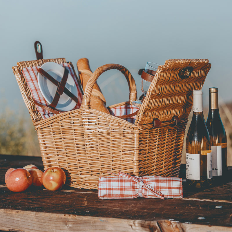 Piccadilly picnic basket set with two wicker baskets, red-and-white plaid cloth and bottles