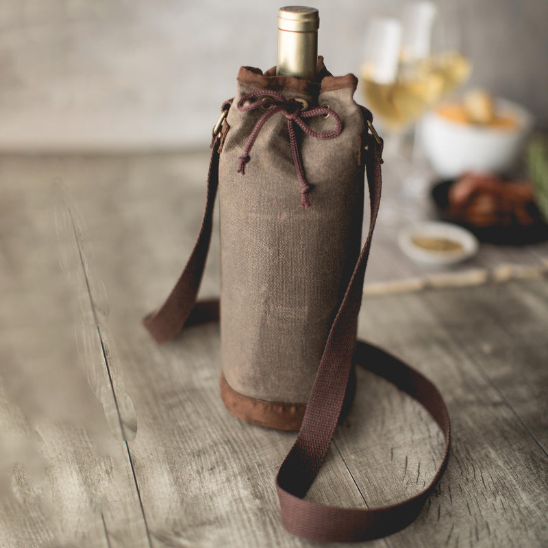 Waxed canvas wine bottle tote with drawstring top and carry strap