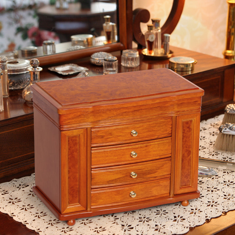 Oak-finish wooden jewelry box with hinged lid and three-drawer front with brass knobs