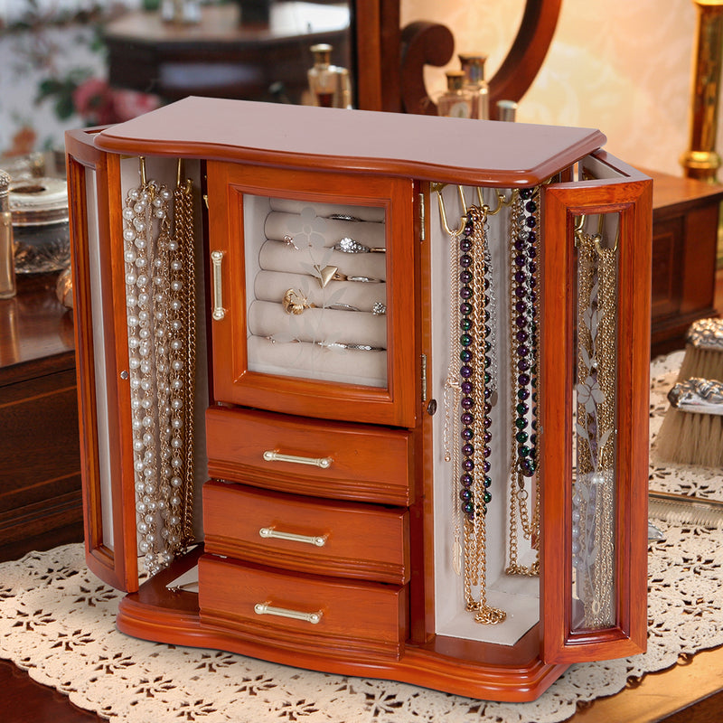 Walnut-finish wooden jewelry box with doors open, showing ring holder and hanging necklace hooks