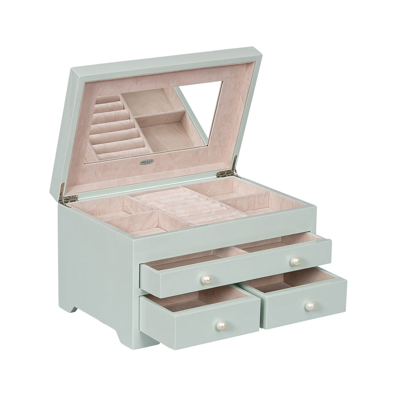 Seafoam green wooden jewelry box with open lid, ring tray and three drawers