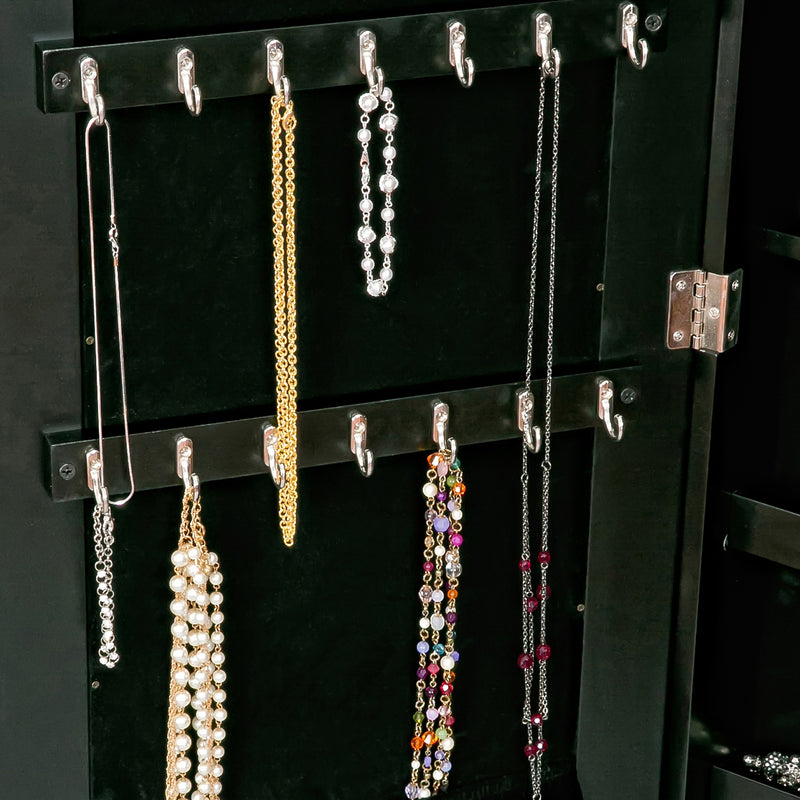 Black jewelry armoire open, necklaces hanging from top hooks and side rods