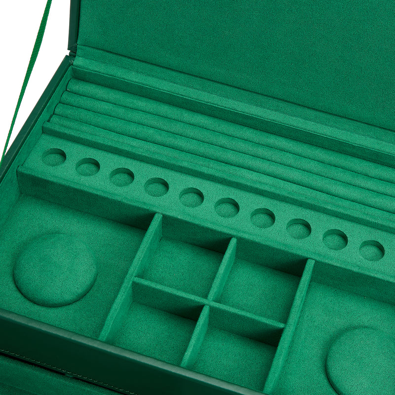 Forest green jewelry box interior with ring slots and open accessory trays