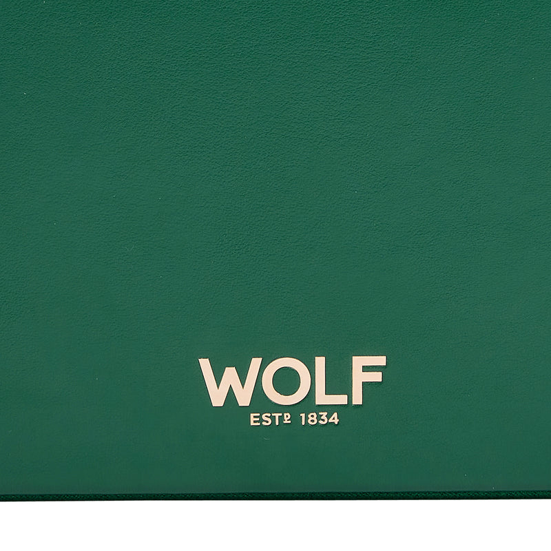 WOLF branded forest green leather jewelry box front panel with gold text