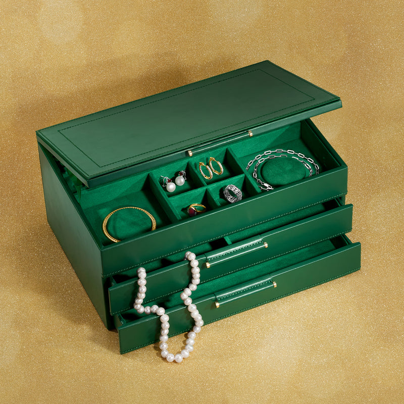 Forest green leather jewelry box displaying necklaces and bracelets in open compartments