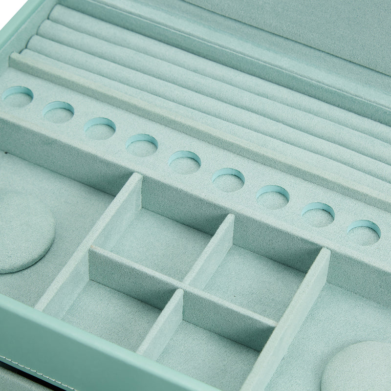 Open jewelry box with ring-holder row and stacked divider trays
