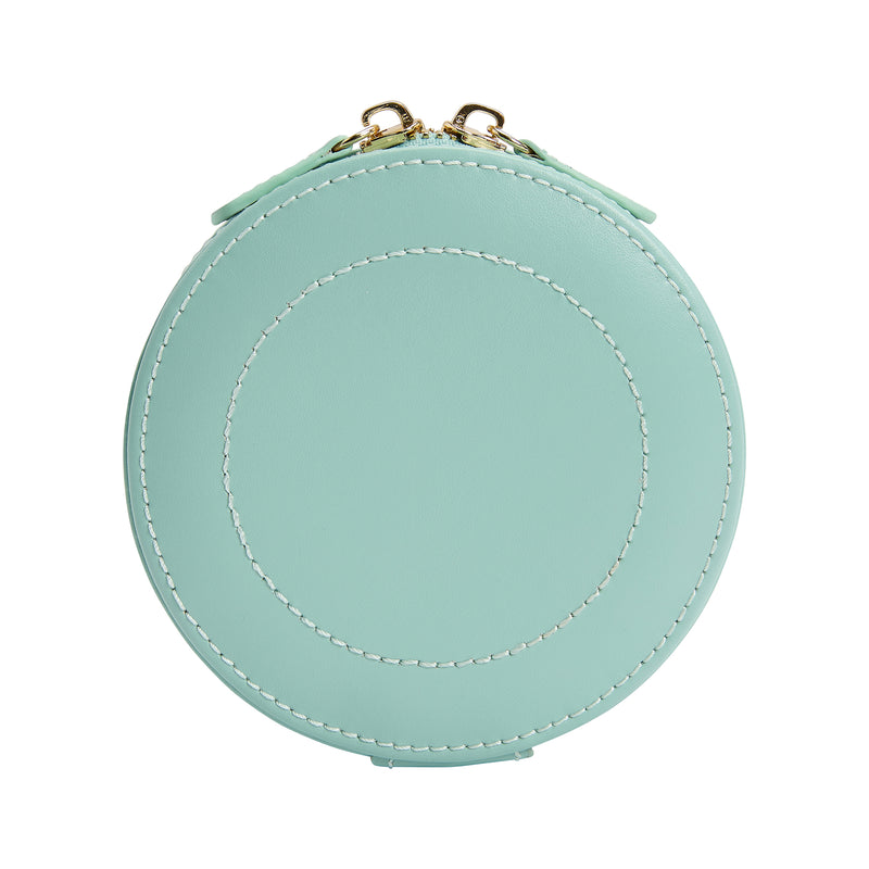 Jade green round mini leather jewelry case with gold zipper pulls on top, contrast stitched seam.