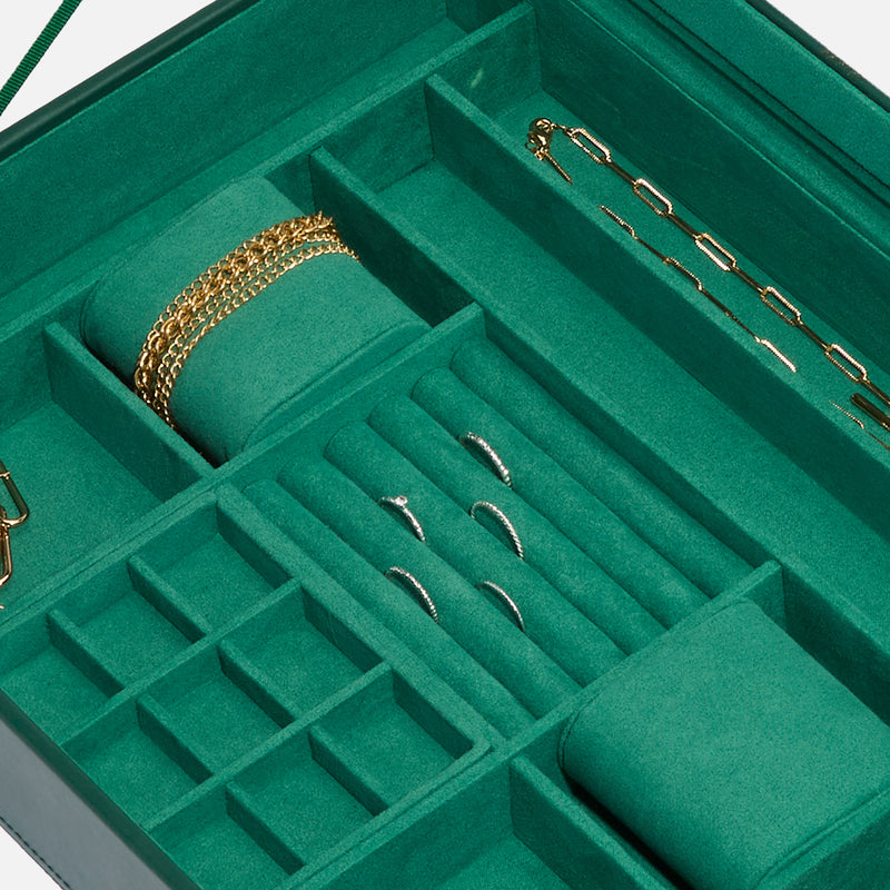 Forest green interior of jewelry box with ring slots, necklace area, and gold push pin tools