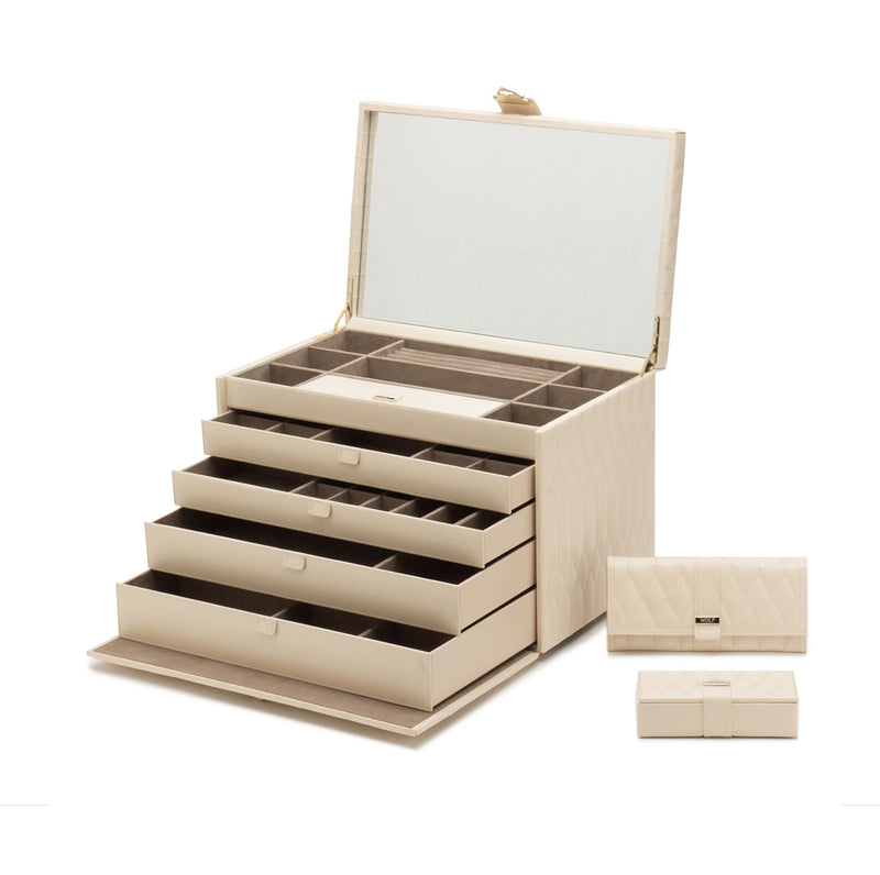 Ivory jewelry box open with stacked drawer compartments and hinged lid