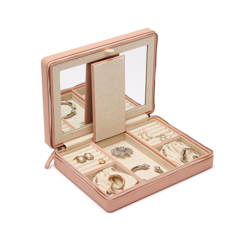 Large blush faux leather travel jewelry case, open with compartments for rings and necklaces
