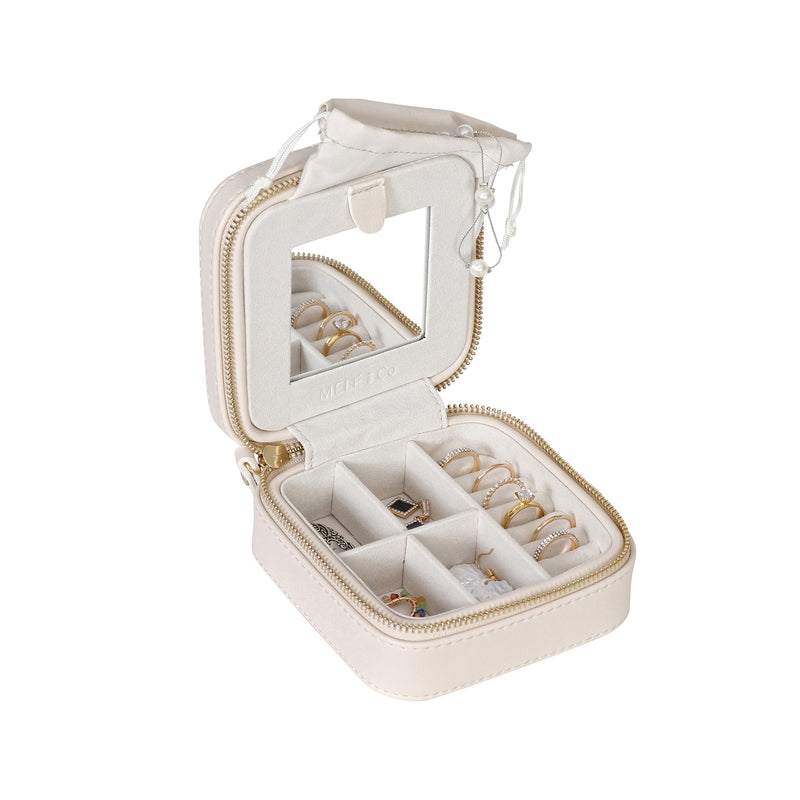 Mele & Co. cream vegan leather square travel jewelry box, open with compartment trays