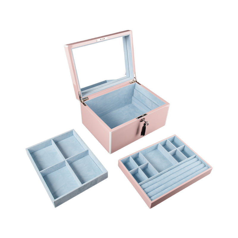 Pink jewelry box with open lid and blue padded inserts, including divider tray