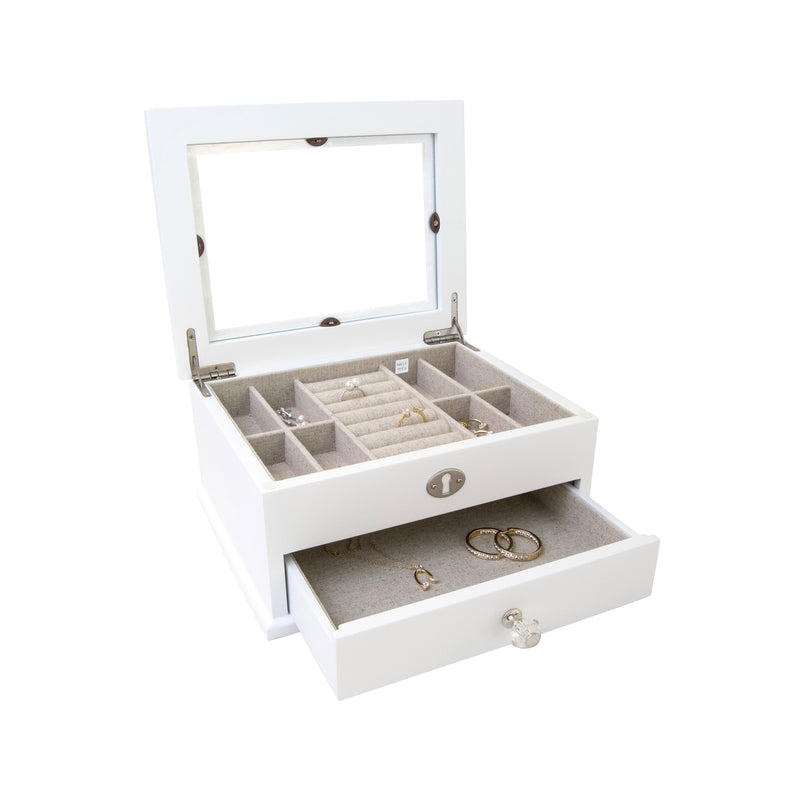White wooden jewelry box with glass lid, open with ring and earring compartments
