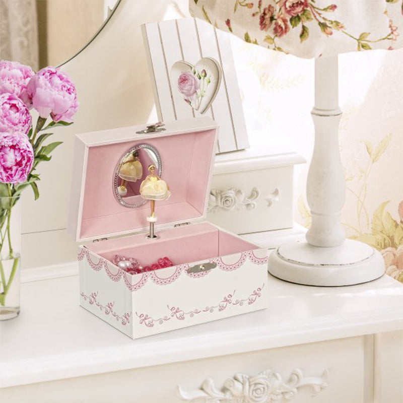 Pink ballerina musical jewelry box on display, open lid with ballerina figurine and mirror