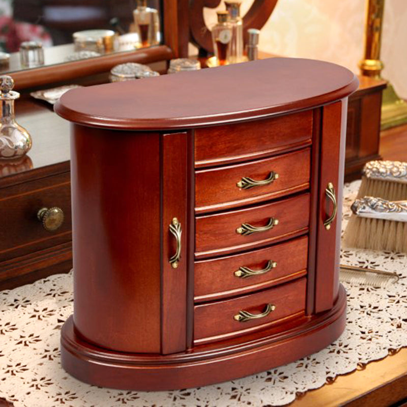 Brown walnut-finish jewelry box with side doors, curved drawers, and brass handles