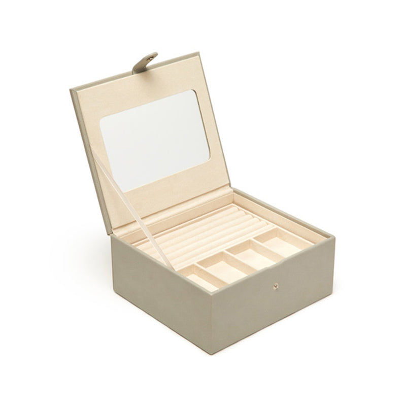 Gray faux leather three-tray jewelry box with lid open, showing divided interior trays.