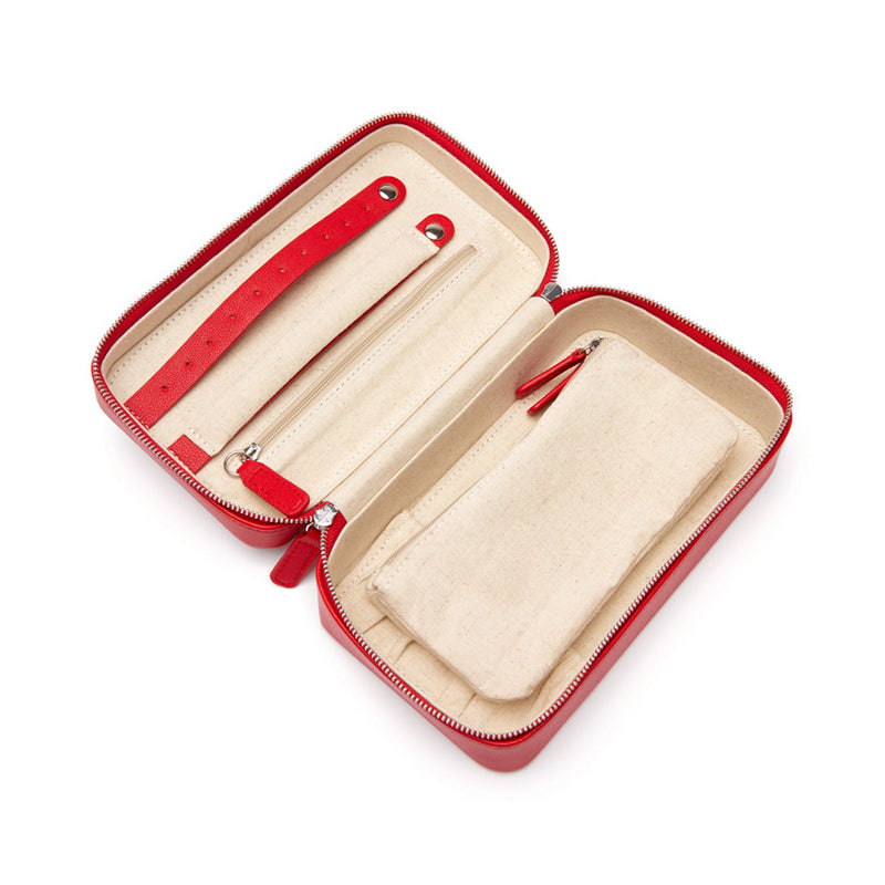 Red faux leather travel jewelry case, open with elastic straps and zip compartments, medium.