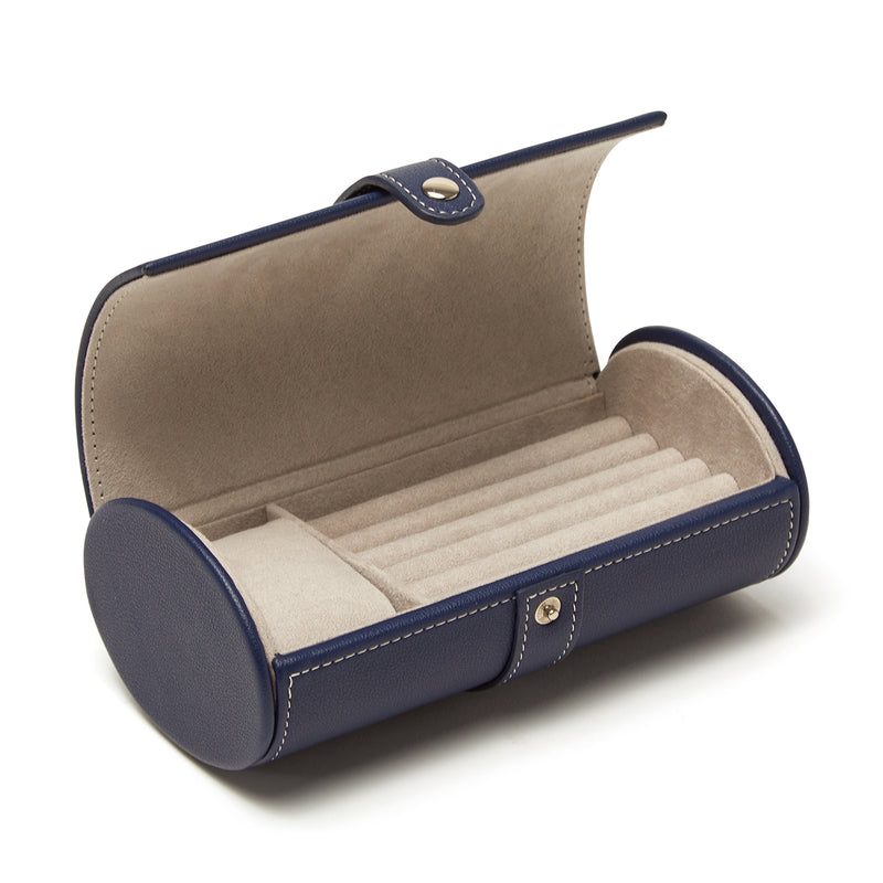 Brouk & Co. Riley navy faux leather travel jewelry roll with snap strap and beige compartments