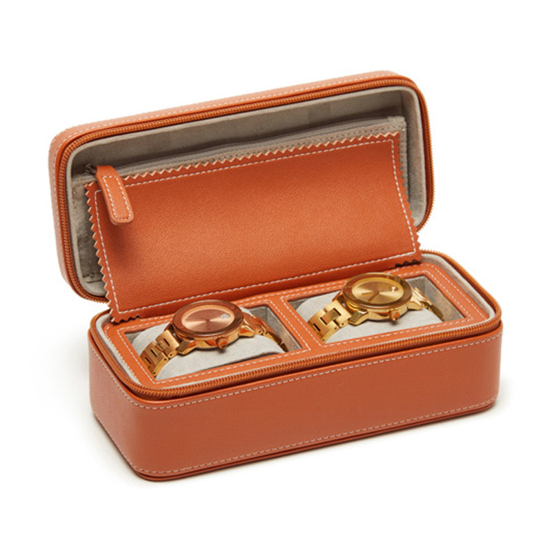 Brown faux leather travel watch case with two compartments, open to show two watches inside.