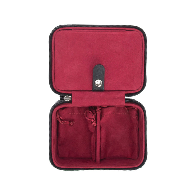 Black faux leather travel jewelry case, open with velvet-lined compartments
