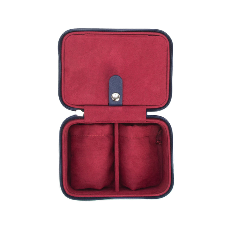 Navy faux leather travel jewelry case with red lining and snap lock, two compartments