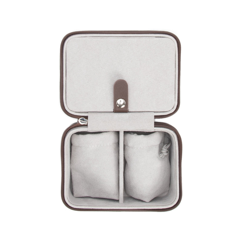 Chocolate-brown faux leather travel jewelry case, open with padded compartments