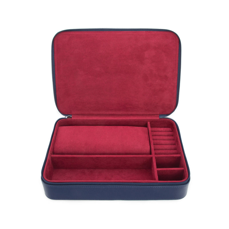 Brouk & Co. travel jewelry case in navy faux leather with open red organizer tray