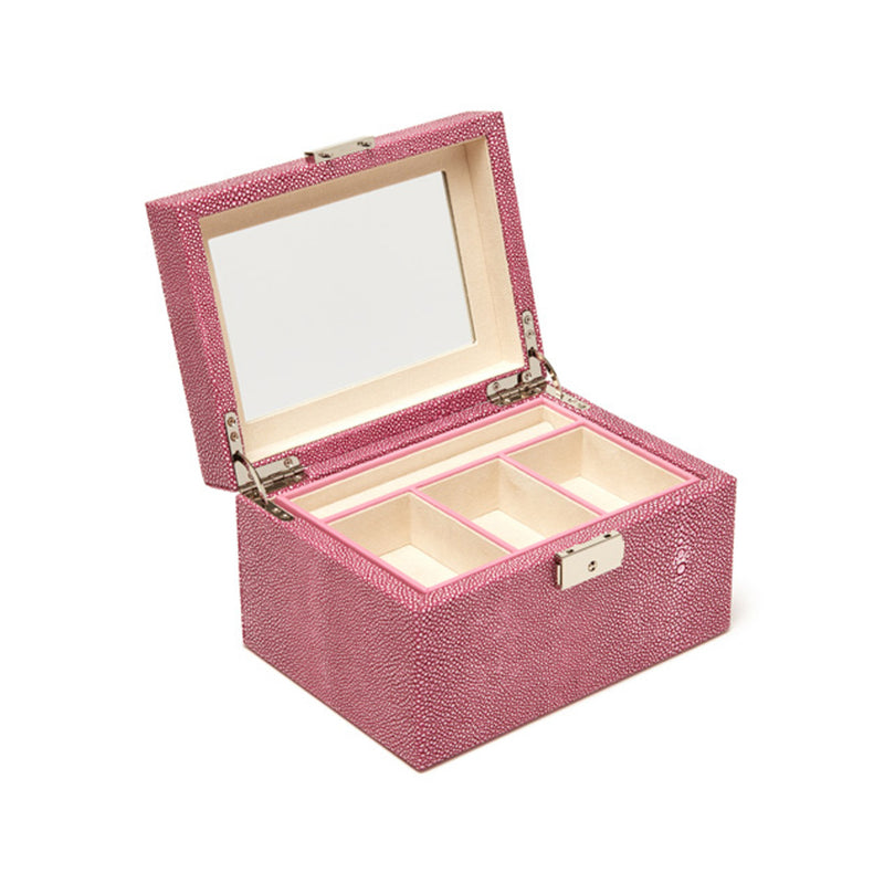 Pink faux leather jewelry box with textured finish, open lid, and four ring compartments