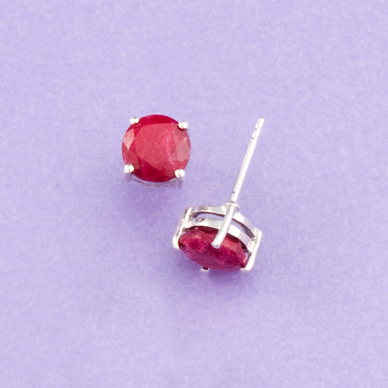 Sterling silver ruby stud earring with round red gemstone and prong setting