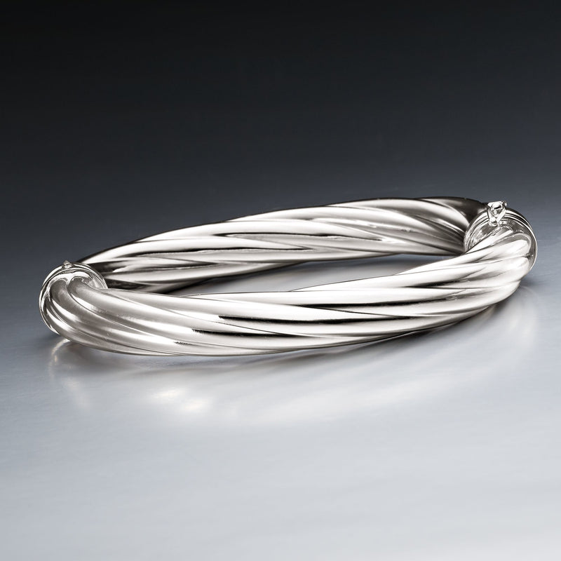 Twisted sterling silver bangle bracelet with rounded ends