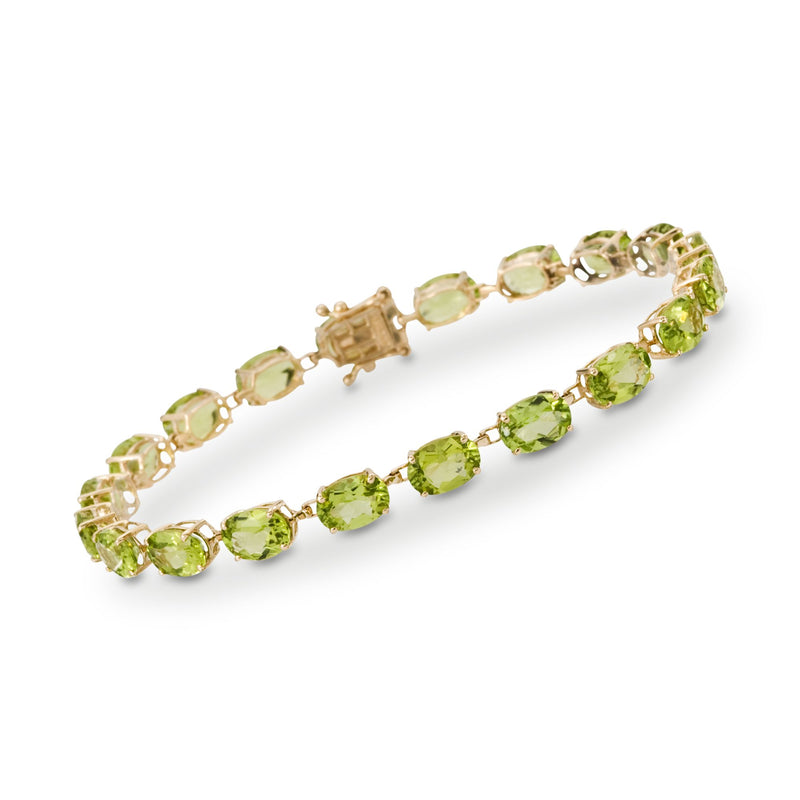 14k yellow gold peridot bracelet with green oval stones and box clasp