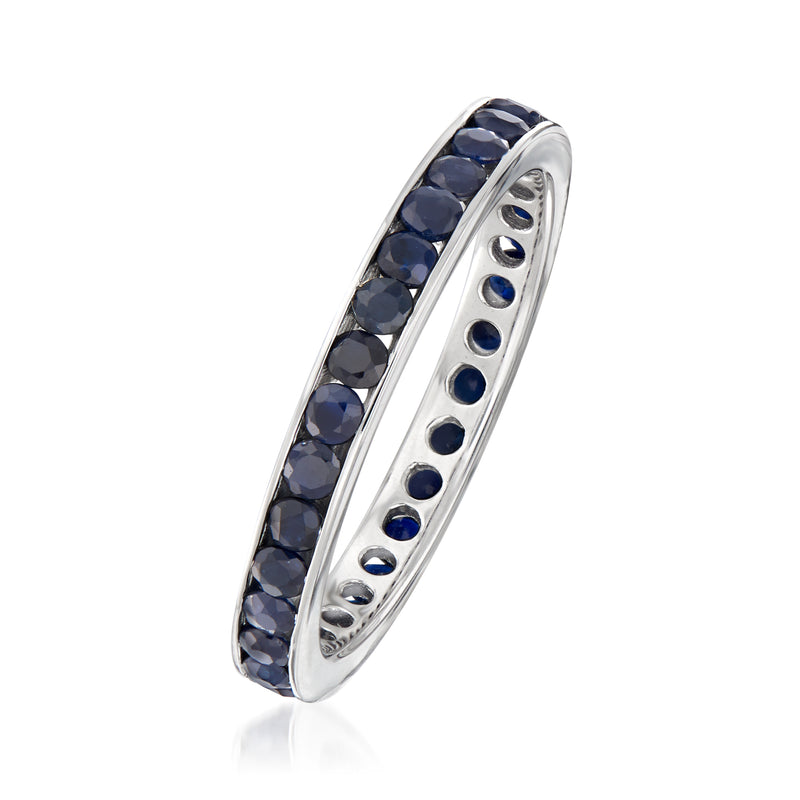 Sterling silver sapphire eternity band, side view with dark blue stones in channel setting.