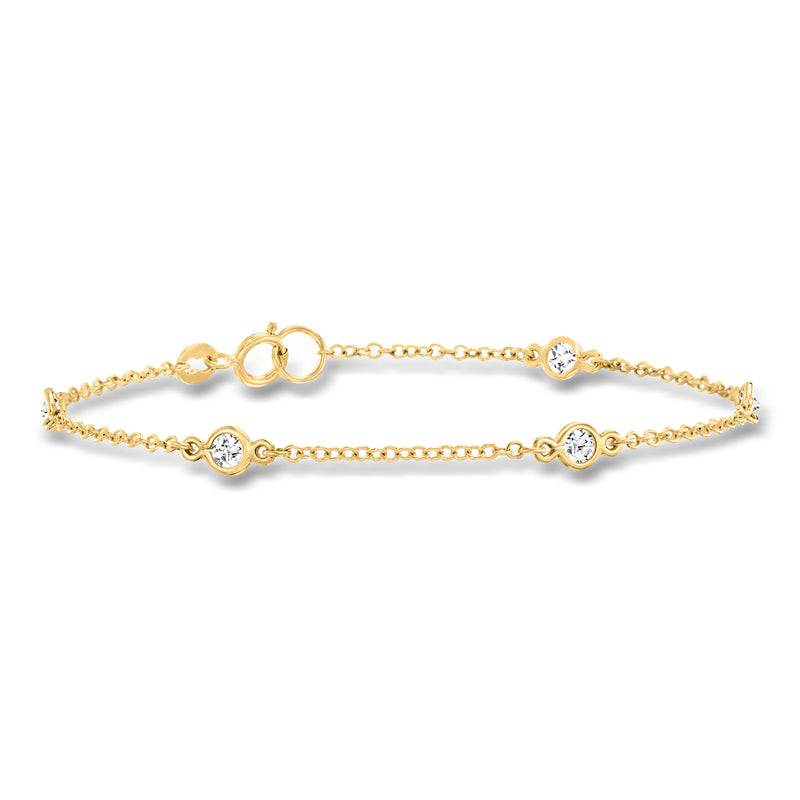 Gold over sterling CZ station tennis bracelet with round bezel stones and toggle clasp