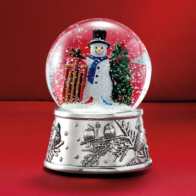 Reed & Barton musical snow globe with snowman, gifts, and pine trees under glass dome